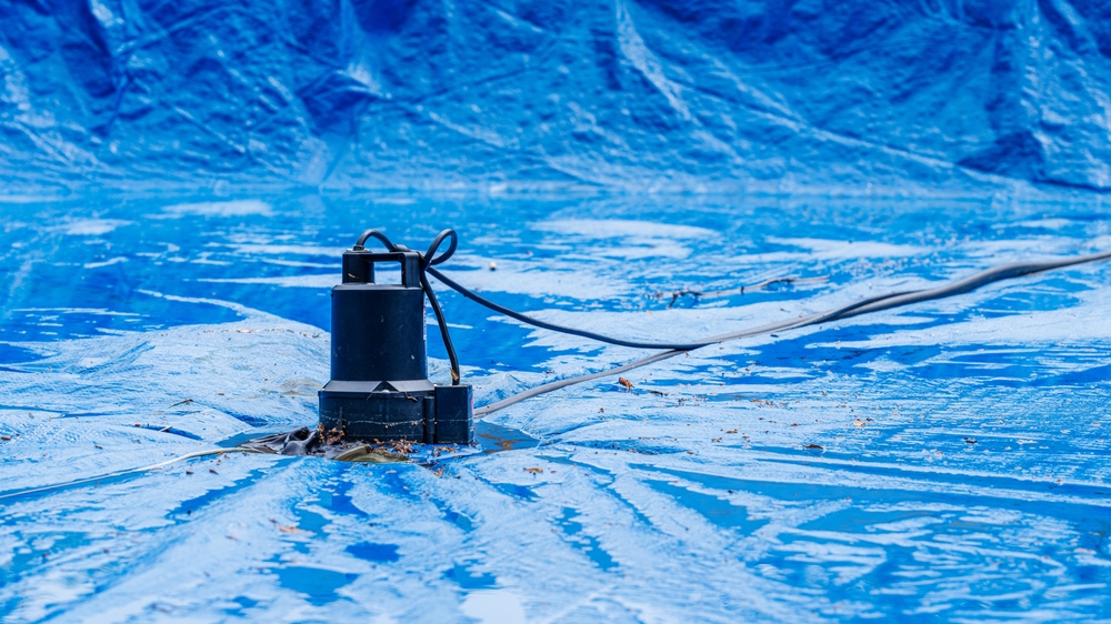 Effective Pool Winterizing with Water Pump on Pool Cover